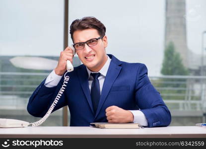 Angry call center employee yelling at customer. The angry call center employee yelling at customer