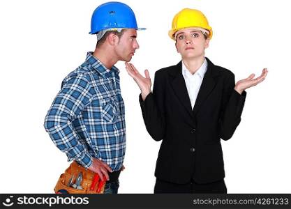 Angry foreman with helpless woman entrepreneur