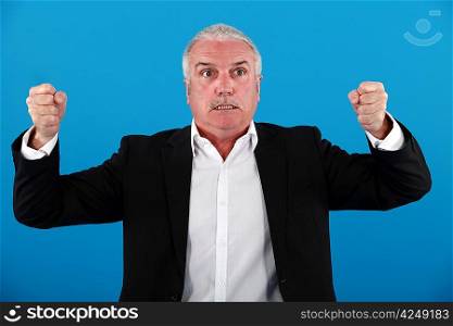 Angry grey-haired businessman