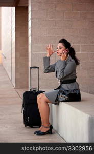 Angry Hispanic Woman Traveler Talking on Cell Phone