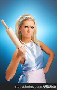 Angry housewife with rolling pin