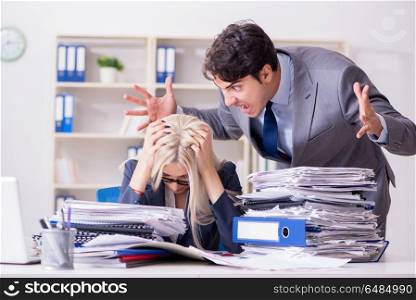 Angry irate boss yelling and shouting at his secretary employee