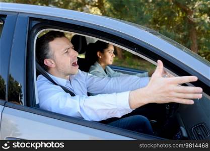angry male driver gesticulating with impatience