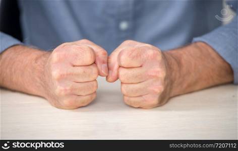 angry man, a close-up of his fists