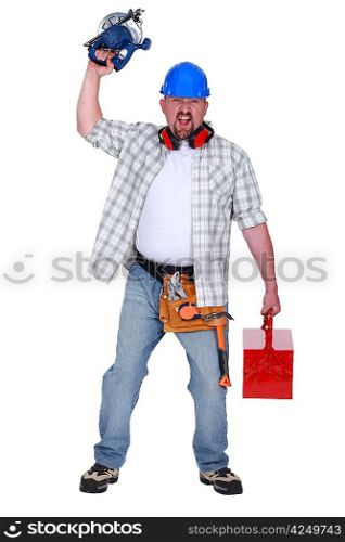 Angry man holding circular saw