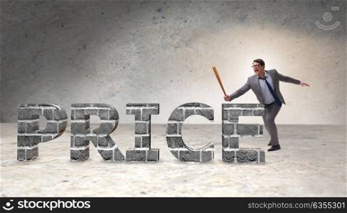 Angry man with baseball bat hitting price word
