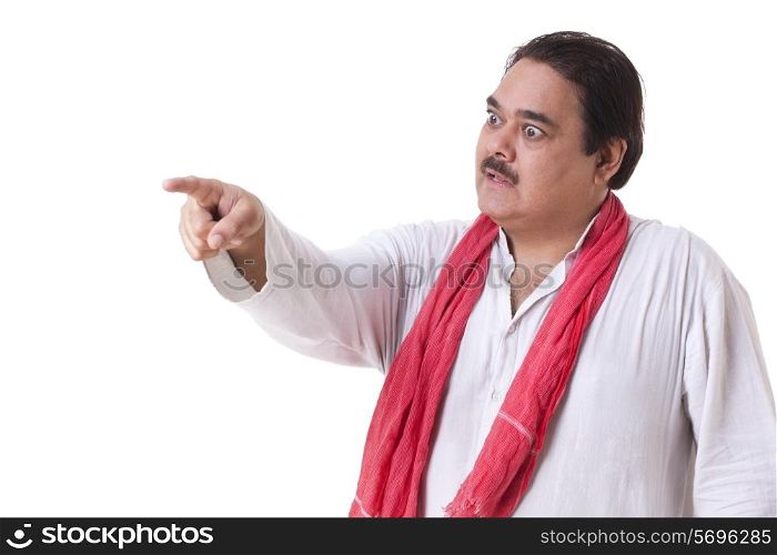 Angry mature politician pointing over white background