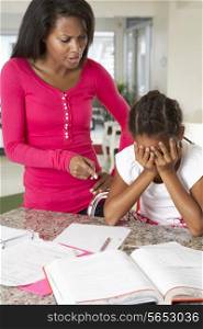 Angry Mother Telling Off Daughter About Homework