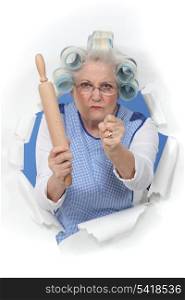 Angry old woman with a rolling pin