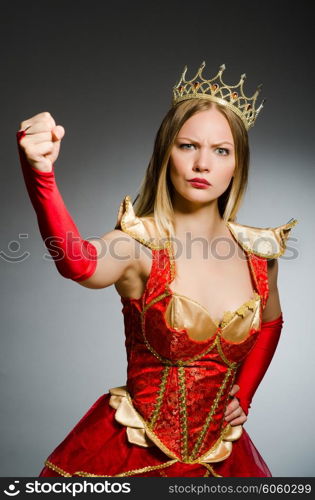 Angry queen against dark background