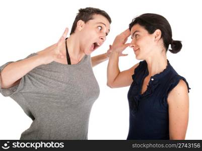angry sisters in their 30s arguing and yelling with each other, isolated on white background