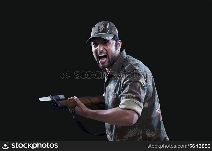 Angry soldier holding gun