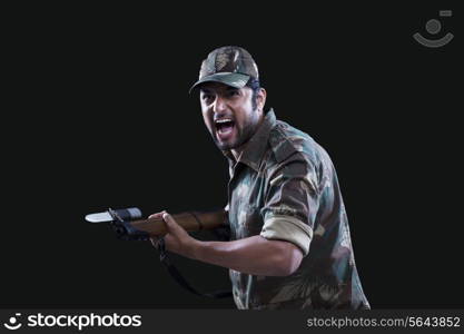 Angry soldier holding gun