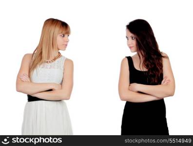 Angry teen sisters isolated on a white background