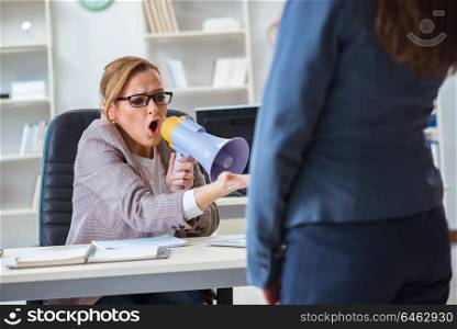 Angry woman boss yelling at her female employee