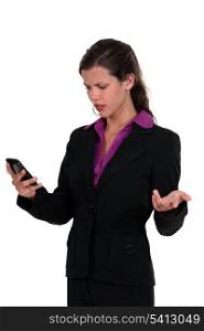 Angry woman reading a text message