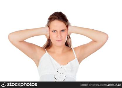 Angry young woman covering her ears isolated on a white background