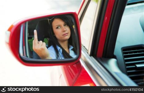 angry young woman is driving a car