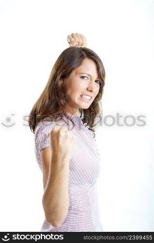 Angry young woman ready for a fight, isolated on white background