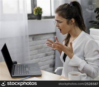 angry young woman working from home