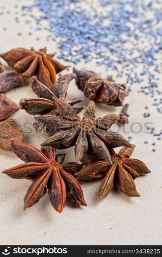 Anise stars close-up on a brown background