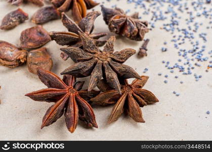 Anise stars close-up on a brown background