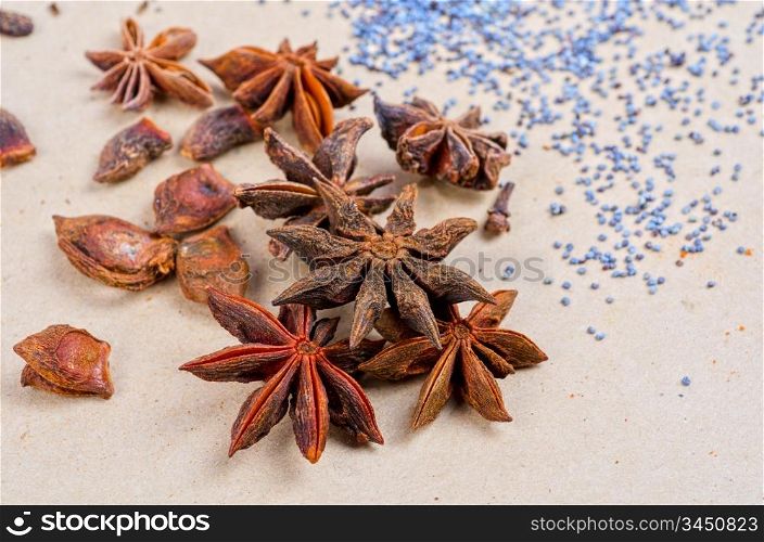 Anise stars close-up on a brown background