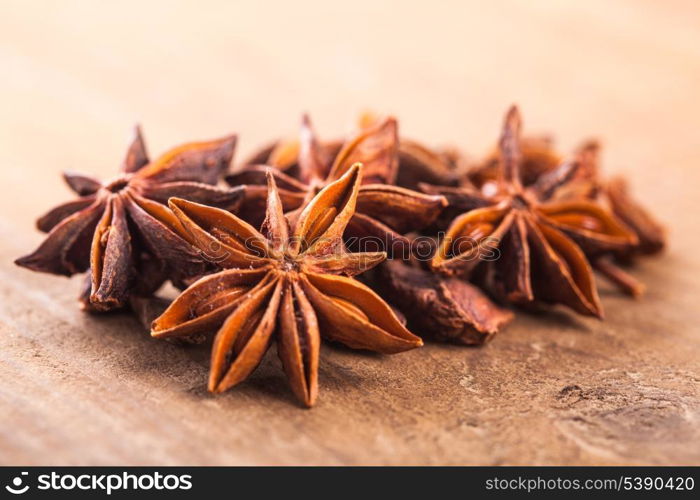 Anise stars heap on the wooden table