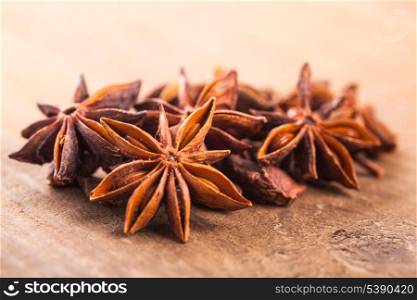 Anise stars heap on the wooden table