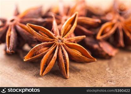 Anise stars heap on the wooden table