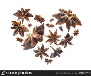 Anise stars in the shape of a heart on a white background.. Anise stars in the shape of a heart on a white background