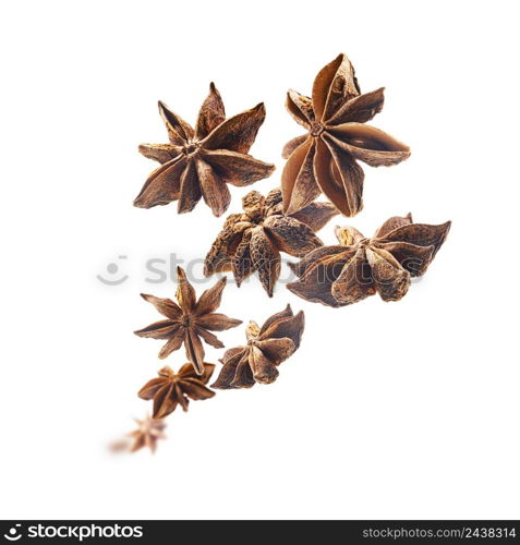 Anise stars levitate on a white background.. Anise stars levitate on a white background