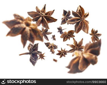 Anise stars levitate on a white background.. Anise stars levitate on a white background