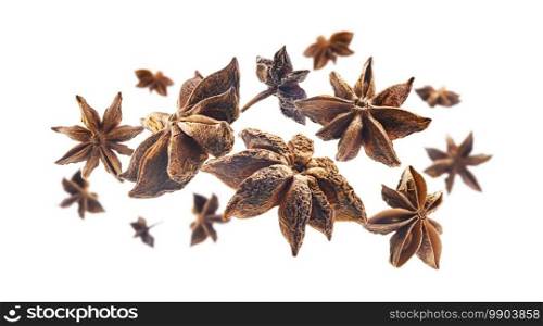 Anise stars levitate on a white background.. Anise stars levitate on a white background