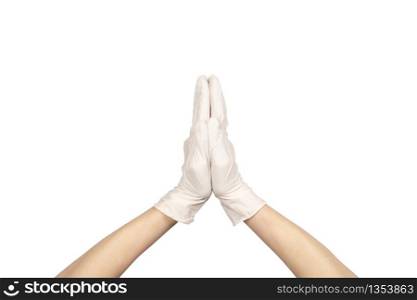Anjali Mudra or Namaste gesture in latex surgical gloved sign against white background. Hand in a white latex glove isolated on white. Woman&rsquo;s hand gesture or sign isolated on white.. Hand in a white latex glove isolated on white. Woman&rsquo;s hand gesture or sign isolated on white.
