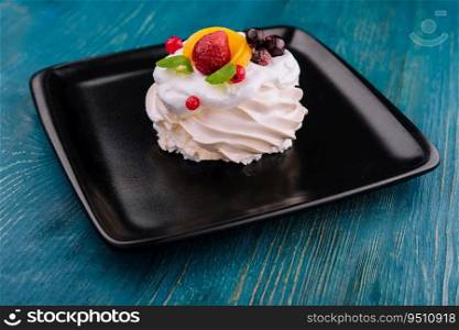 Anna Pavlova cake with cream and fresh berries