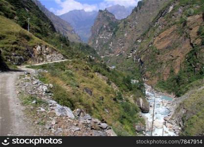 Annapurna trail on the slope of mount and river in Nepal