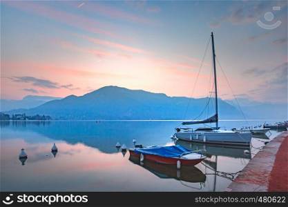 Annecy lake and Alps mountains at sunrise, France, Venice of the Alps, France. Annecy lake and Alps mountains, France