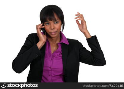 Annoyed businesswoman on the phone