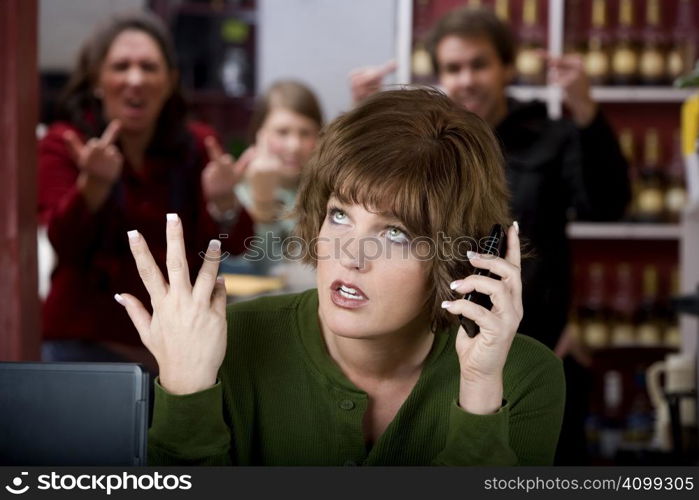 Annoying woman in a cafe on her cell phone gets the finger