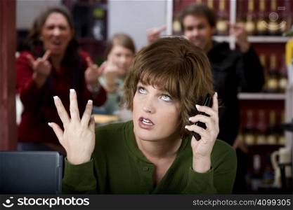 Annoying woman in a cafe on her cell phone gets the finger