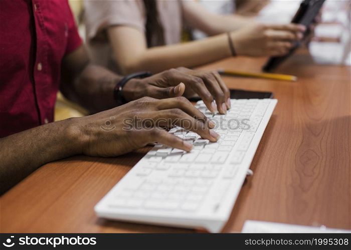 anonymous black man typing
