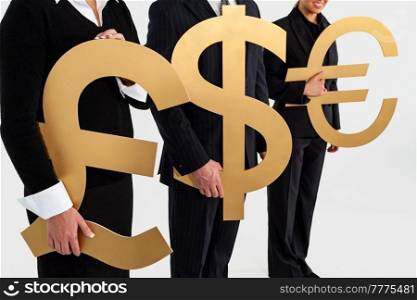 Anonymous business people team, businessman and businesswomen, holding large gold money currency symbols, British Pound, Dollar and Euro. Exchange rate or globalisation global trade concept.