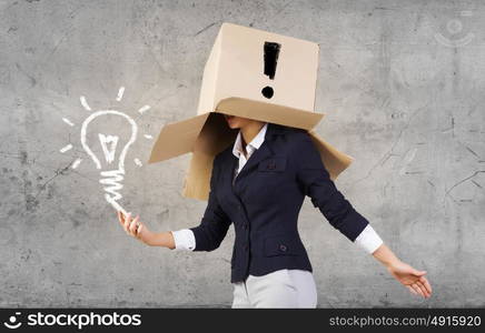 Anonymous call. Businesswoman using mobile phone wearing carton box on head