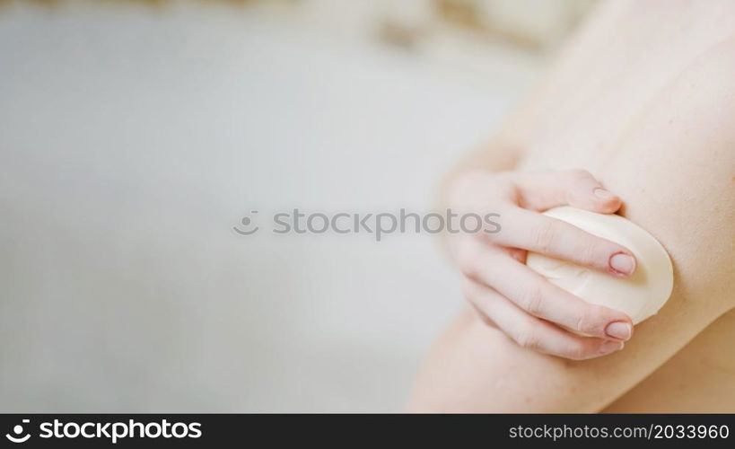 anonymous girl washing with soap