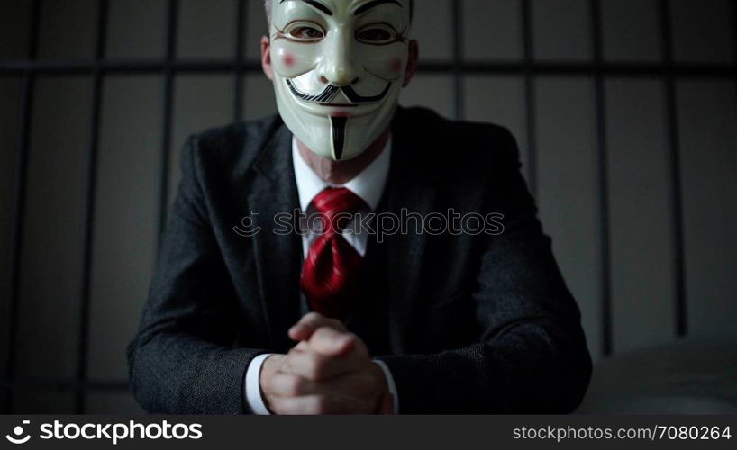 Anonymous hacker seated in prison