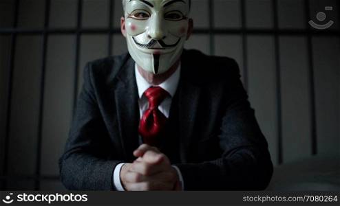 Anonymous hacker seated in prison