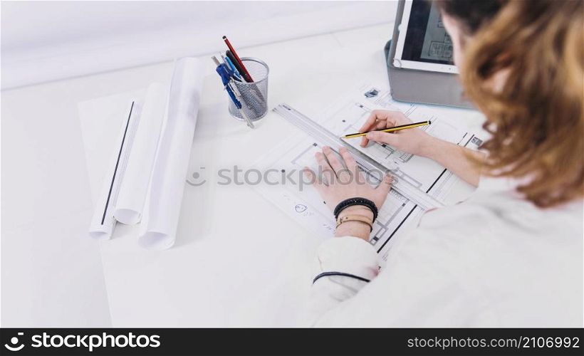 anonymous woman developing blueprint