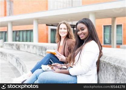 Another day at the university!. Group multi ethnic young students at the university campus