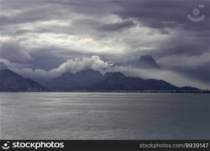 Antalya Bay and Taurus Mountains in cloudy weather after rain,